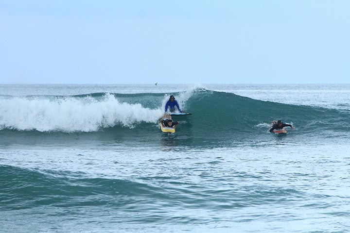 surfing class bigger green waves
